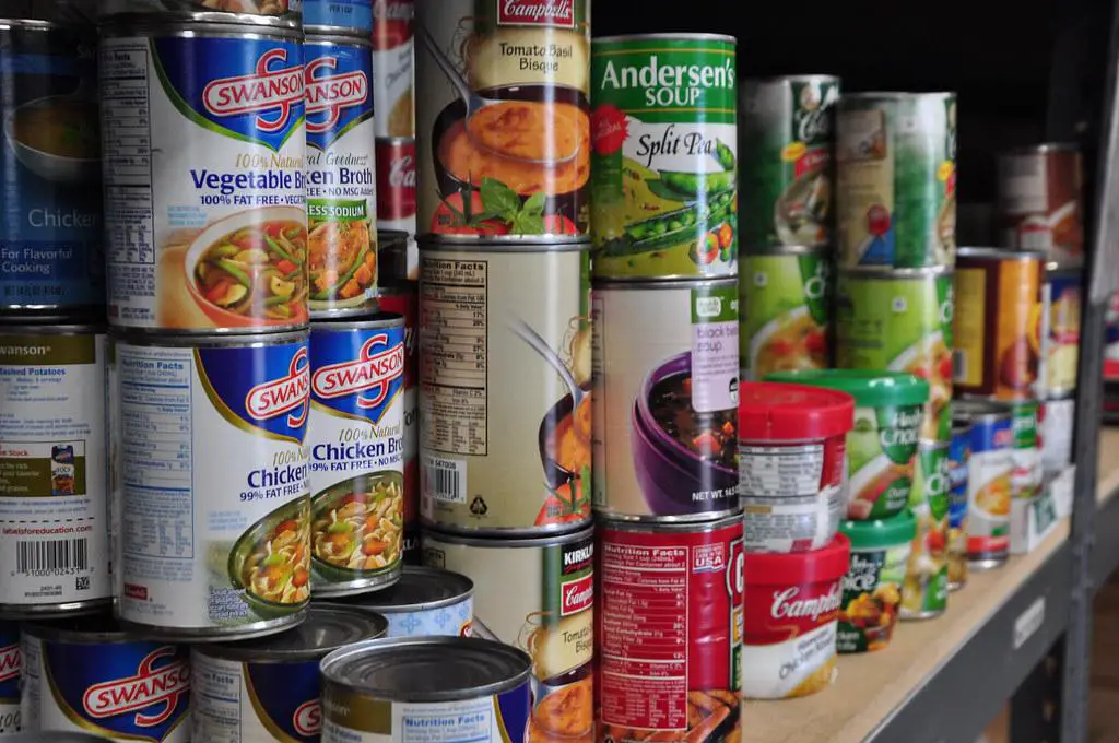 Various non-perishable food items arranged neatly for emergency preparedness